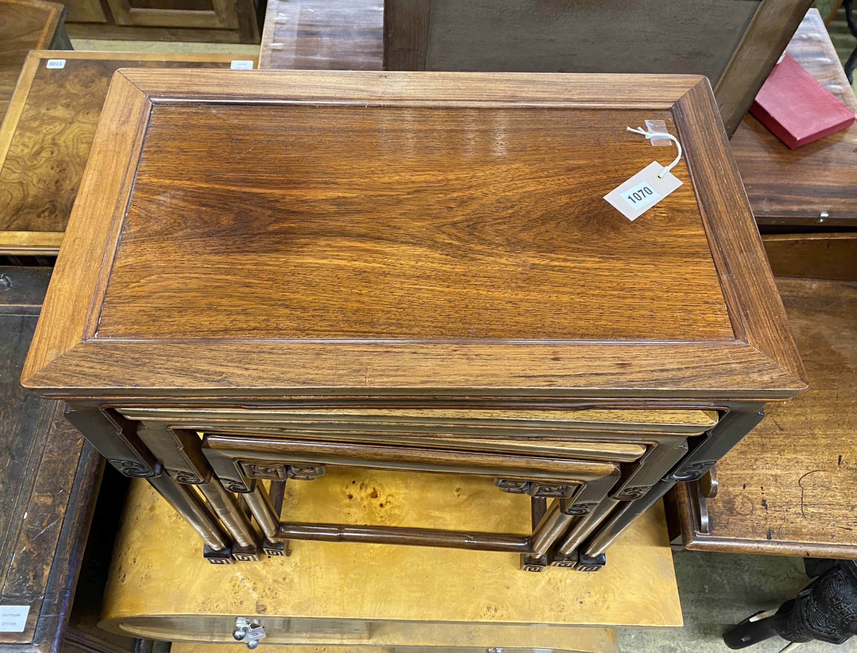 A nest of three Chinese rectangular tea tables, width 61cm, depth 36cm, height 66cm